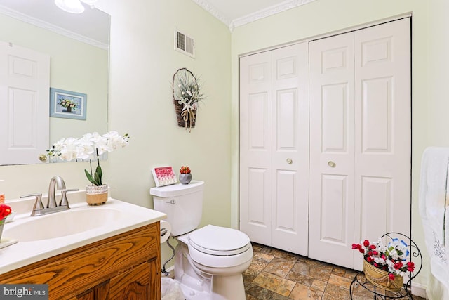 1027 Fredrick Blvd, Reading, PA 19605 - bathroom featuring a closet, ornamental molding, vanity, stone finish floors, and toilet