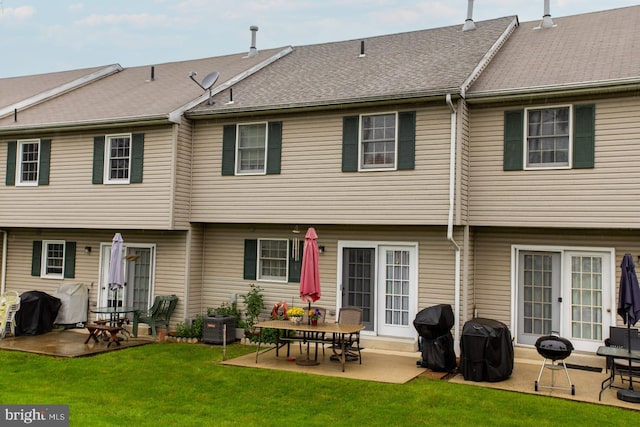 1027 Fredrick Blvd, Reading, PA 19605 - rear view of house with a patio and a yard