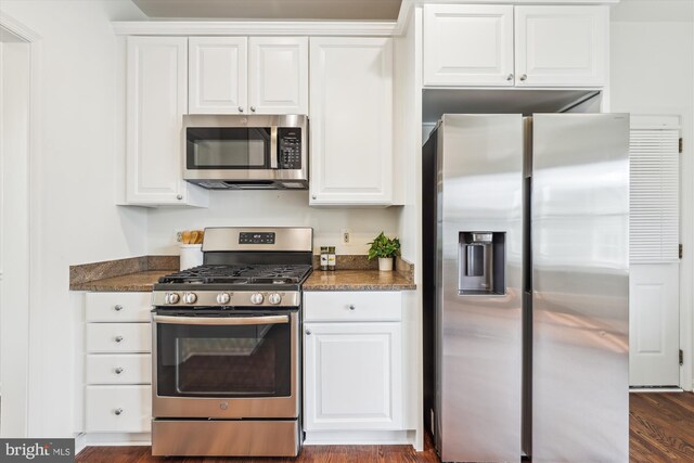 2142 N Dinwiddie St, Arlington, VA 22207 - kitchen featuring appliances with stainless steel finishes, white cabinetry, and dark wood-type flooring