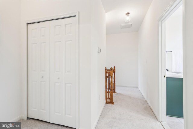 2142 N Dinwiddie St, Arlington, VA 22207 - hallway featuring light colored carpet and baseboards