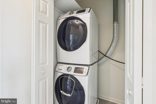 2142 N Dinwiddie St, Arlington, VA 22207 - laundry room featuring estacked washer and dryer and baseboards