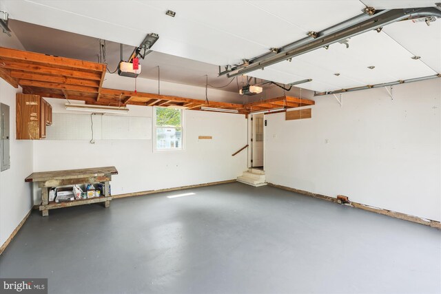 2142 N Dinwiddie St, Arlington, VA 22207 - garage featuring a garage door opener and electric panel
