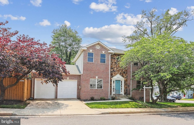 2142 N Dinwiddie St, Arlington, VA 22207 - view of front of home with a garage, concrete driveway, brick siding, and roof with shingles