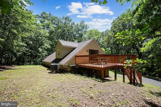734 Log Cabin Ln, Berkeley Springs, WV 25411 - rear view of house with a wooden deck, roof with shingles, and central air condition unit