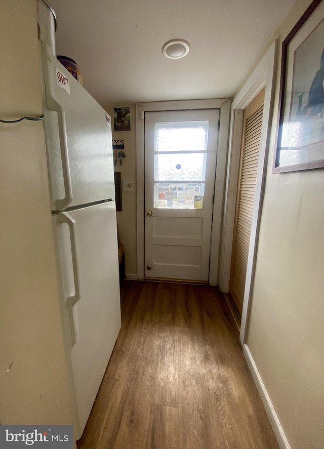 220 N 3rd St, Millville, NJ 08332 - doorway featuring wood finished floors and baseboards
