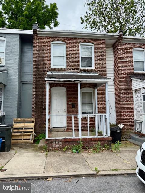 600 Keystone Ave Unit 63, Darby, PA 19023 - view of property featuring brick siding and a porch