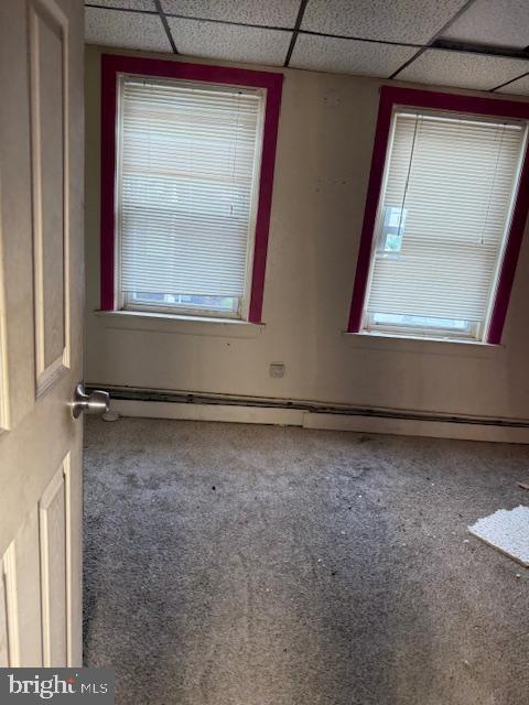 600 Keystone Ave Unit 63, Darby, PA 19023 - carpeted spare room with a paneled ceiling, a baseboard heating unit, and healthy amount of natural light