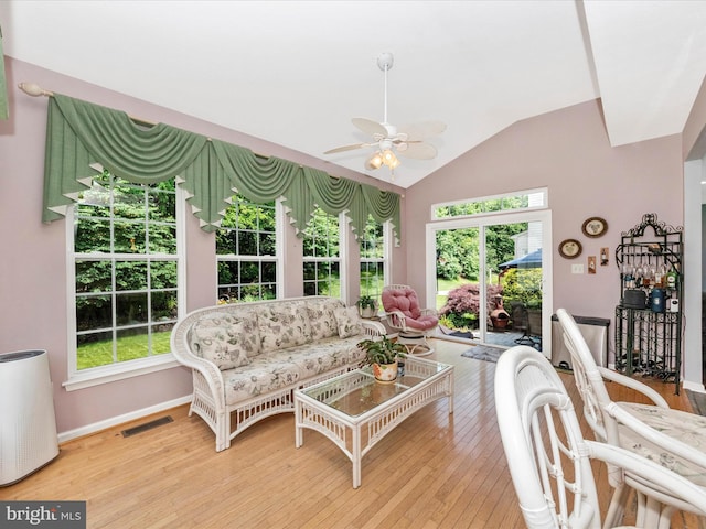 7732 Rotherham Dr, Hanover, MD 21076 - living room featuring a ceiling fan, lofted ceiling, wood-type flooring, and plenty of natural light