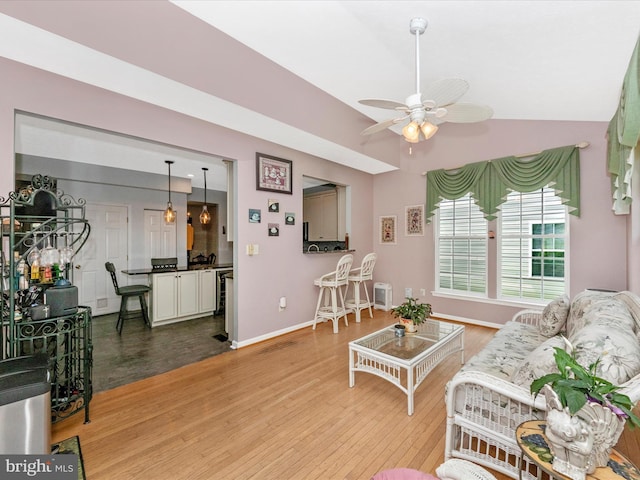 7732 Rotherham Dr, Hanover, MD 21076 - living room with a ceiling fan, light wood-type flooring, and vaulted ceiling
