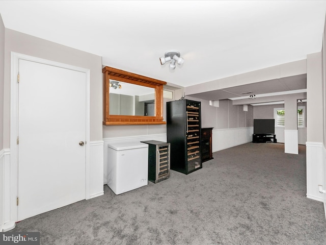 7732 Rotherham Dr, Hanover, MD 21076 - unfurnished living room featuring carpet floors and a wainscoted wall