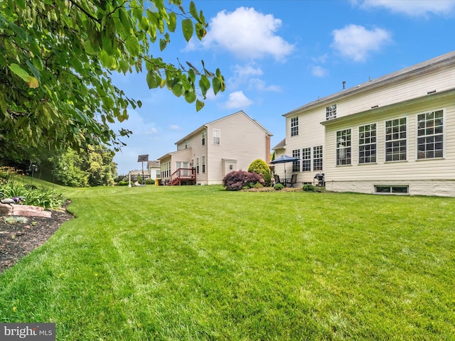 7732 Rotherham Dr, Hanover, MD 21076 - view of grassy yard with a wooden deck