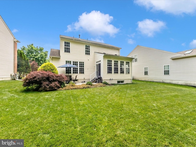 7732 Rotherham Dr, Hanover, MD 21076 - rear view of house with entry steps and a lawn