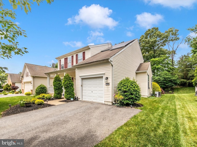 7732 Rotherham Dr, Hanover, MD 21076 - traditional-style house with an attached garage, a front lawn, and asphalt driveway