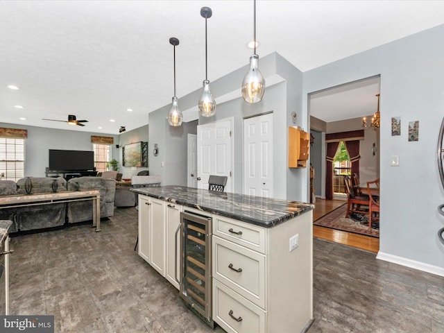7732 Rotherham Dr, Hanover, MD 21076 - kitchen with beverage cooler, ceiling fan, a chandelier, white cabinetry, and dark stone countertops