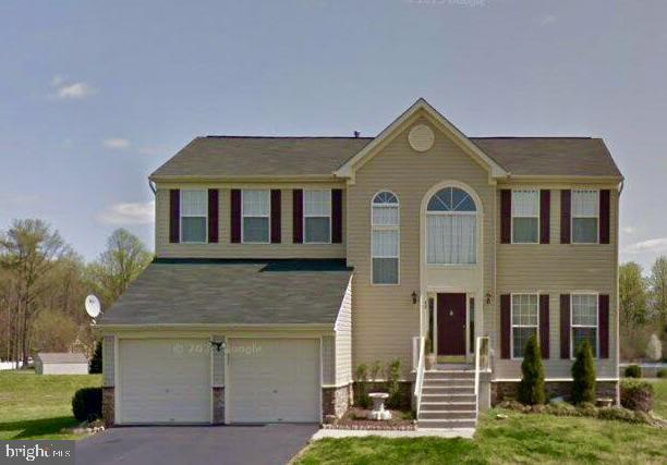 42 Saundra St, Frederica, DE 19946 - colonial-style house with an attached garage and driveway