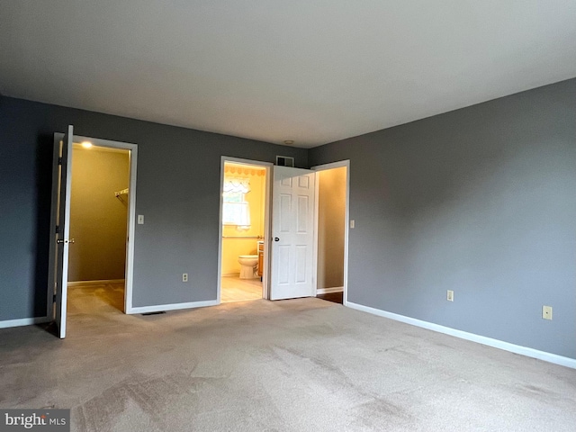 28 Willow Way Dr, Enola, PA 17025 - unfurnished bedroom featuring a spacious closet, carpet, and ensuite bathroom