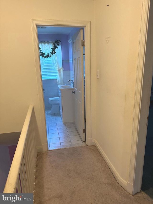 1525 Clairidge Rd, Baltimore, MD 21207 - hallway featuring light colored carpet and light tile patterned floors