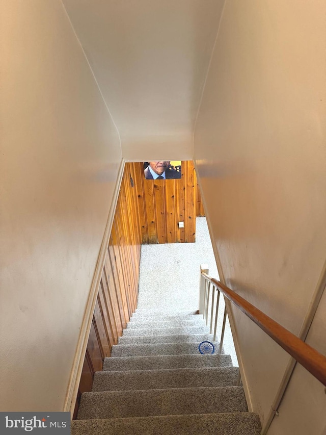 1525 Clairidge Rd, Baltimore, MD 21207 - stairway featuring carpet flooring and wood walls