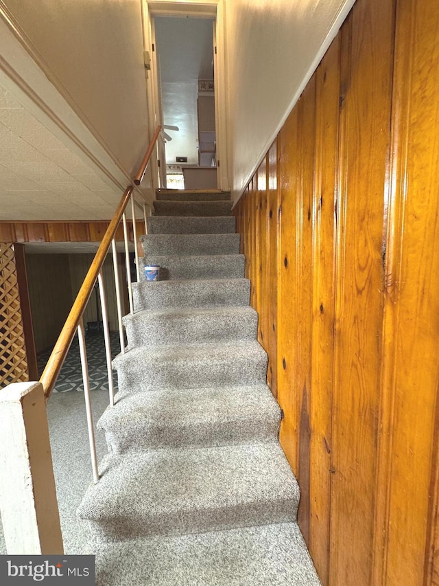 1525 Clairidge Rd, Baltimore, MD 21207 - staircase with carpet and wood walls