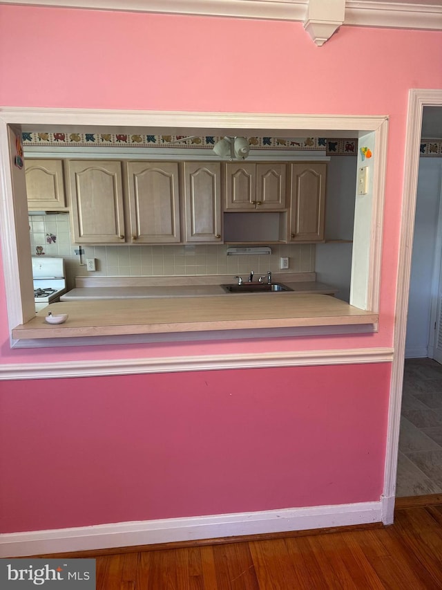 1525 Clairidge Rd, Baltimore, MD 21207 - kitchen with decorative backsplash, stove, and light countertops