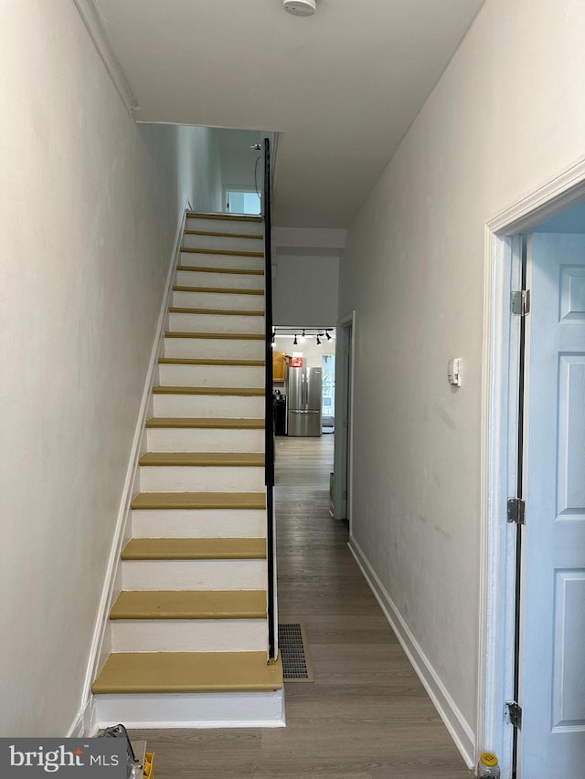 1009 W Susquehanna Ave, Philadelphia, PA 19122 - stairway with wood finished floors