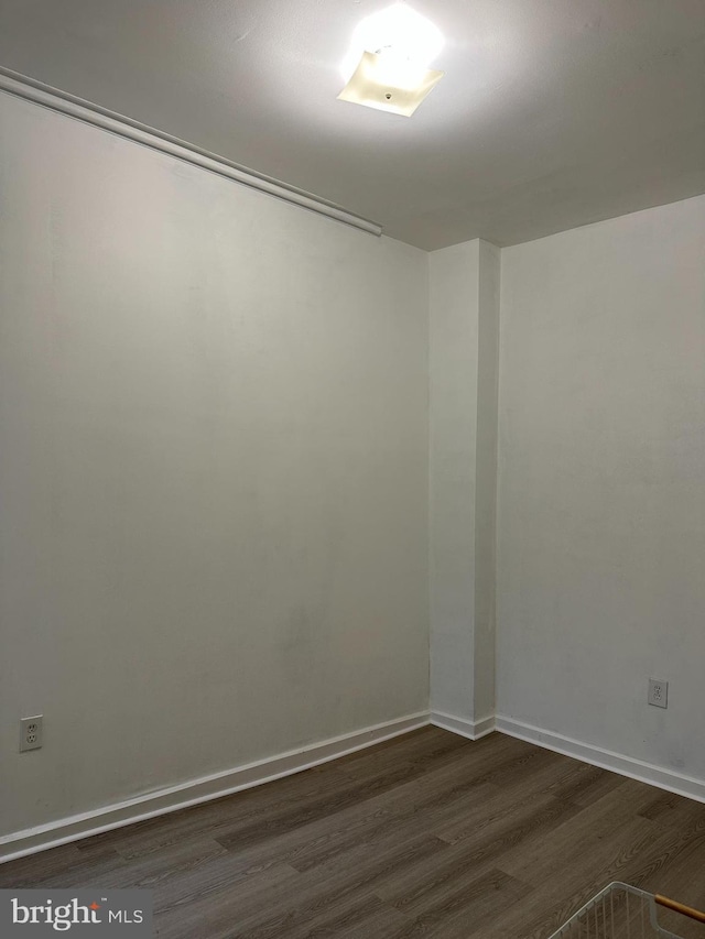 1009 W Susquehanna Ave, Philadelphia, PA 19122 - empty room featuring dark wood-style flooring and baseboards