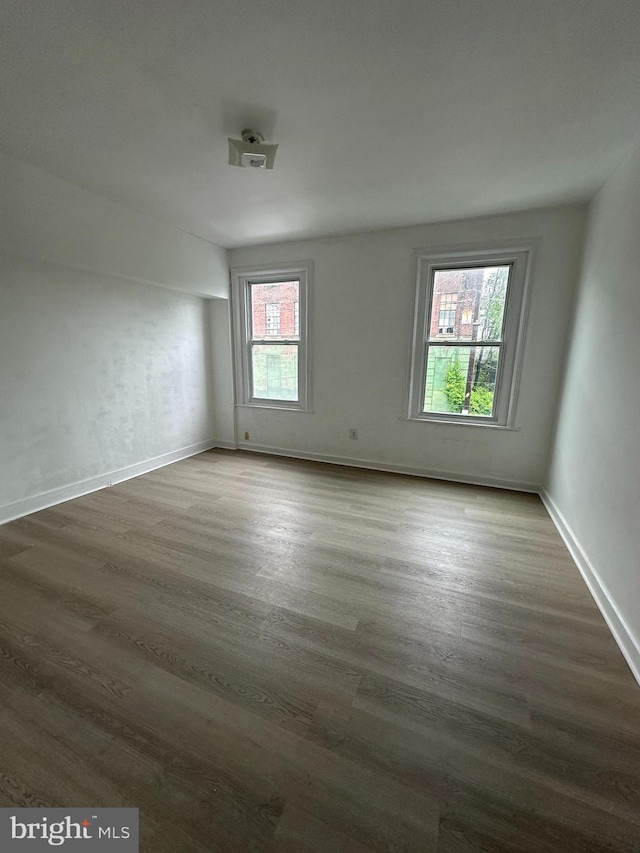 1009 W Susquehanna Ave, Philadelphia, PA 19122 - unfurnished room featuring dark wood-style floors and baseboards