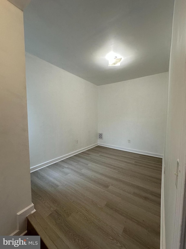 1009 W Susquehanna Ave, Philadelphia, PA 19122 - unfurnished room with dark wood-type flooring and baseboards
