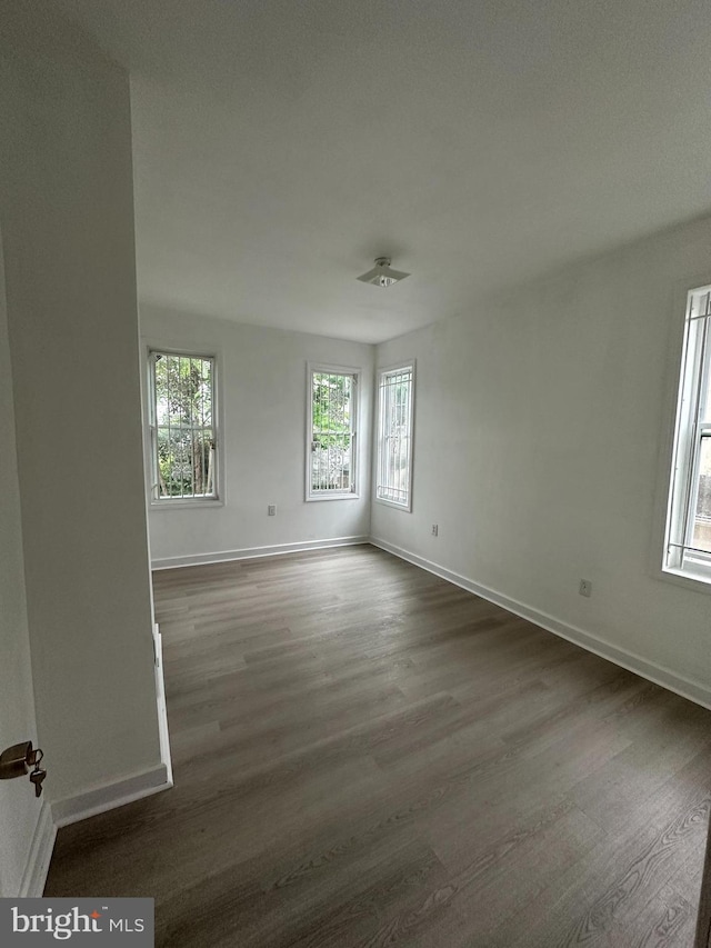 1009 W Susquehanna Ave, Philadelphia, PA 19122 - empty room featuring dark wood-type flooring and baseboards
