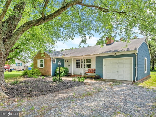 1002 Sherwood Cir, Salisbury, MD 21804 - ranch-style home featuring a chimney, an attached garage, and gravel driveway