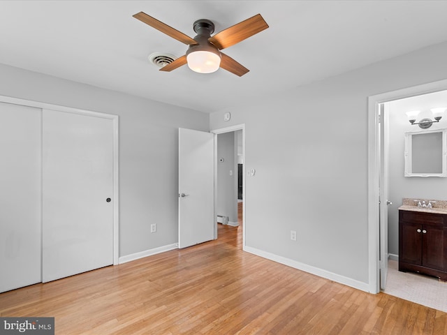 1002 Sherwood Cir, Salisbury, MD 21804 - unfurnished bedroom featuring light wood-style floors, ensuite bathroom, a closet, and ceiling fan