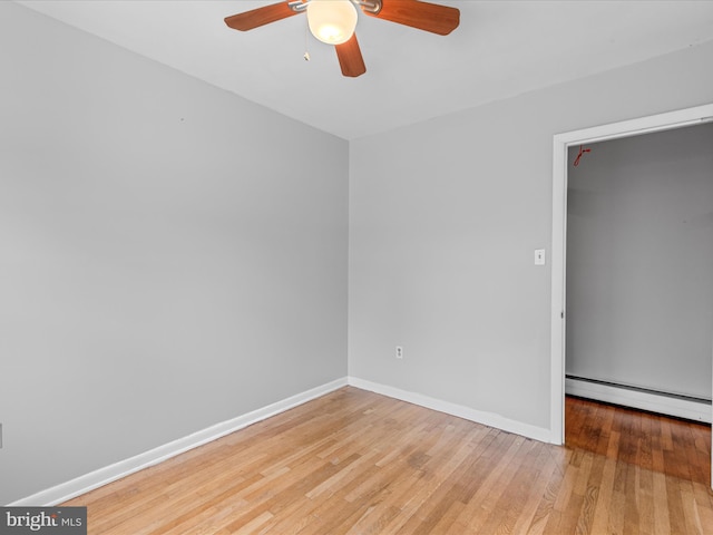 1002 Sherwood Cir, Salisbury, MD 21804 - empty room with a baseboard radiator, ceiling fan, and light wood-style floors