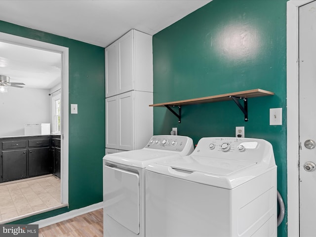 1002 Sherwood Cir, Salisbury, MD 21804 - washroom with cabinet space, washer and clothes dryer, ceiling fan, and light wood-style flooring