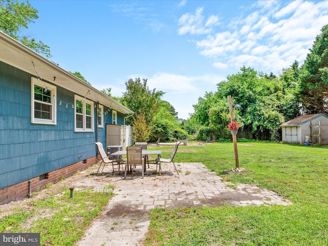 1002 Sherwood Cir, Salisbury, MD 21804 - view of grassy yard with a patio, outdoor dining area, and a storage shed