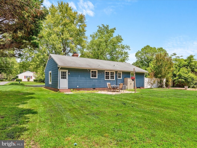 1002 Sherwood Cir, Salisbury, MD 21804 - back of house featuring entry steps, a chimney, and a patio area