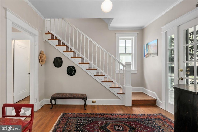 6721 Piney Branch Rd NW, Washington, DC 20012 - entrance foyer featuring wood finished floors, stairs, baseboards, and ornamental molding
