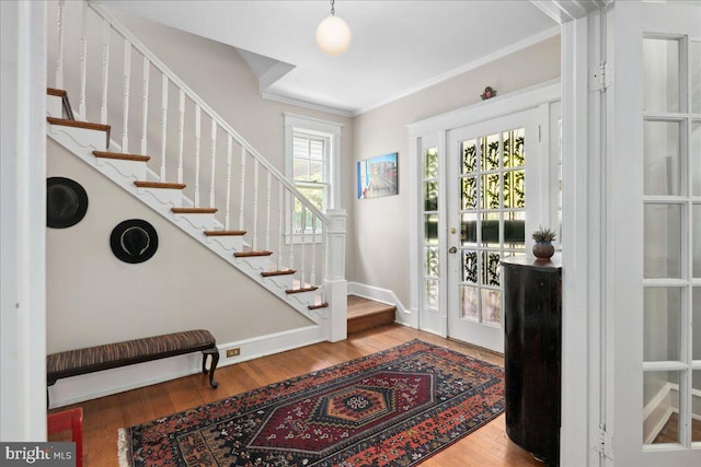 6721 Piney Branch Rd NW, Washington, DC 20012 - entrance foyer featuring stairway, crown molding, wood finished floors, and baseboards
