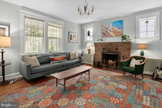 6721 Piney Branch Rd NW, Washington, DC 20012 - living area with wood finished floors, a chandelier, and a fireplace