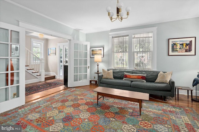 6721 Piney Branch Rd NW, Washington, DC 20012 - living room featuring stairs, wood finished floors, a chandelier, french doors, and baseboards