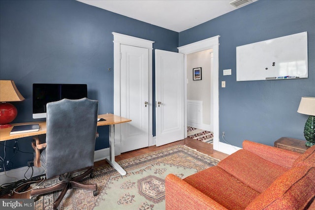 6721 Piney Branch Rd NW, Washington, DC 20012 - home office with wood finished floors and baseboards