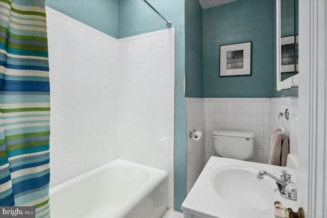 6721 Piney Branch Rd NW, Washington, DC 20012 - bathroom with a sink, shower / bathtub combination with curtain, wainscoting, and toilet