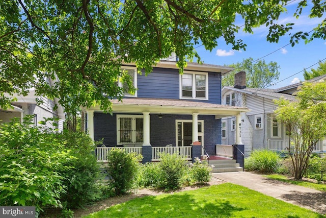 6721 Piney Branch Rd NW, Washington, DC 20012 - american foursquare style home featuring covered porch, a front yard, and brick siding