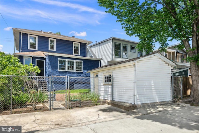 6721 Piney Branch Rd NW, Washington, DC 20012 - view of front facade featuring a gate and an outbuilding
