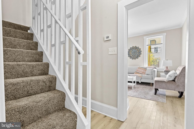 3414 Old York Rd, Baltimore, MD 21218 - stairway with wood finished floors, baseboards, and crown molding