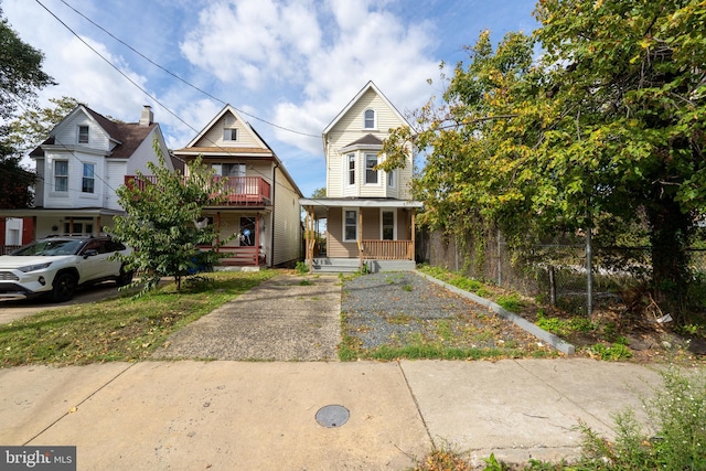 3414 Old York Rd, Baltimore, MD 21218 - view of front facade with covered porch and a balcony