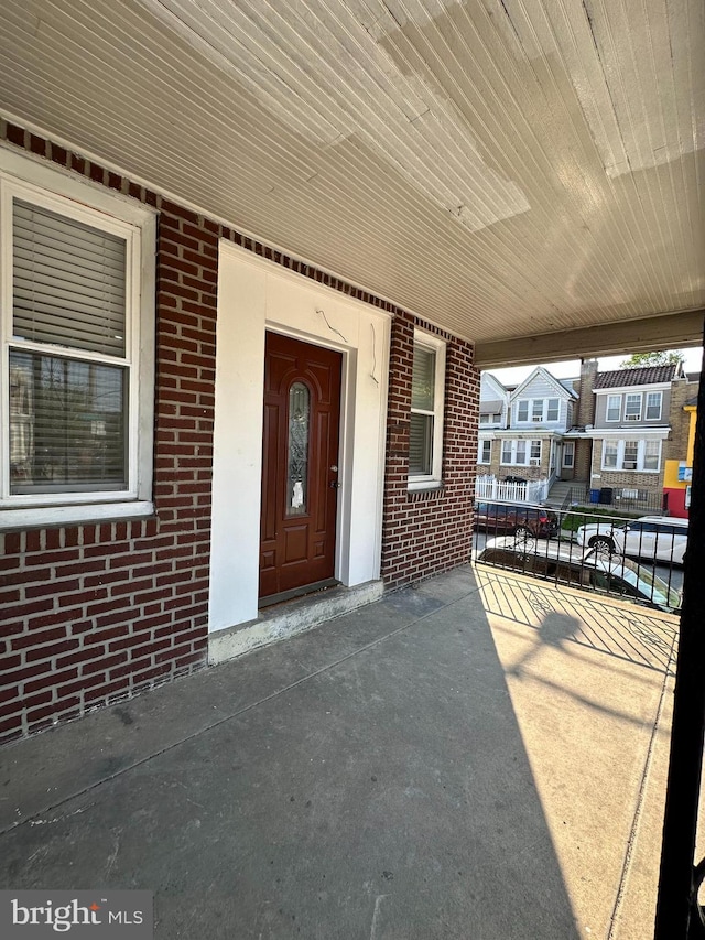 528 E Cheltenham Ave, Philadelphia, PA 19120 - property entrance with brick siding and covered porch