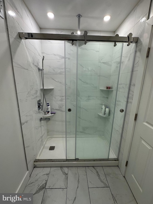 528 E Cheltenham Ave, Philadelphia, PA 19120 - bathroom featuring marble look tiles, a shower stall, and recessed lighting