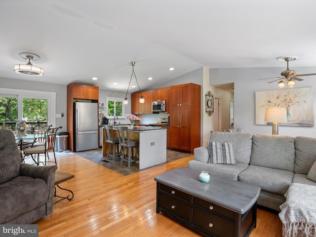 635 Teton Ct, Lothian, MD 20711 - living area with plenty of natural light, vaulted ceiling, light wood-type flooring, recessed lighting, and ceiling fan