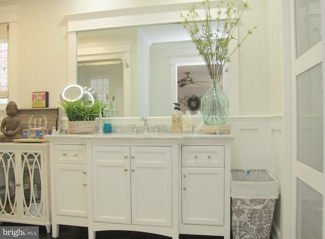 126 Devon Rd, Cinnaminson, NJ 08077 - bathroom with vanity, wainscoting, a decorative wall, crown molding, and ceiling fan