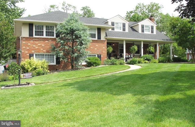 126 Devon Rd, Cinnaminson, NJ 08077 - view of front of home featuring a chimney, brick siding, and a front lawn